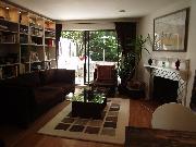 Livingroom, wood burning fireplace, patio