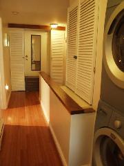 Hallway upstairs with washer/dryer