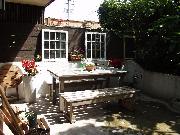Private, fenced off large patio with small garden