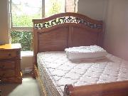Beautifully furnished bedroom with large south-facing window