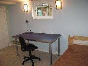 room, single bed w/ desk(centre) and Closet (left)